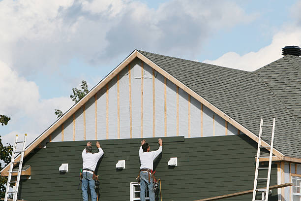 Professional Storm Damage Siding Repair technician working in Bloomington, IN
